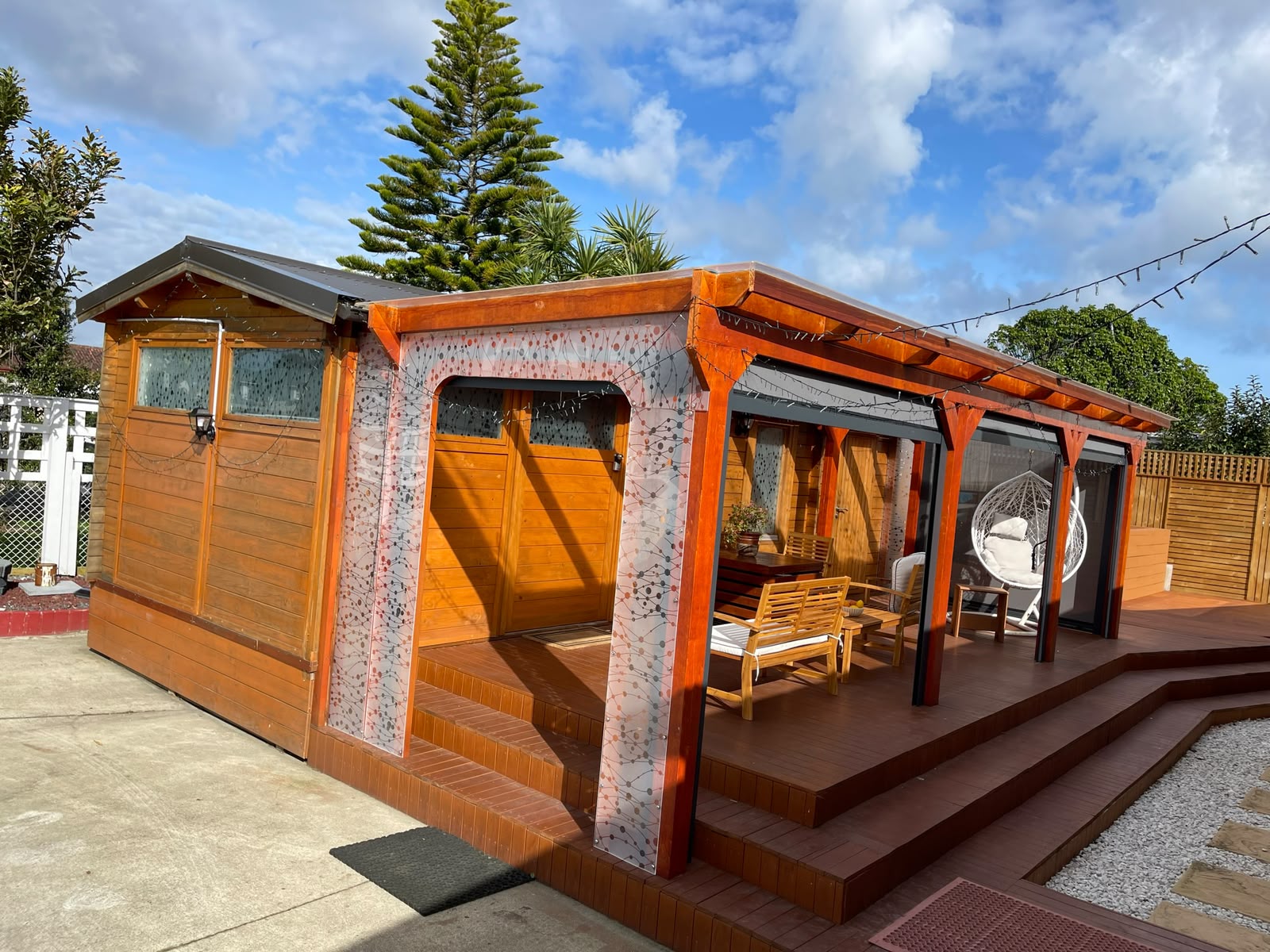 Auckland Airport Cabin's covered deck, seen from the garden.