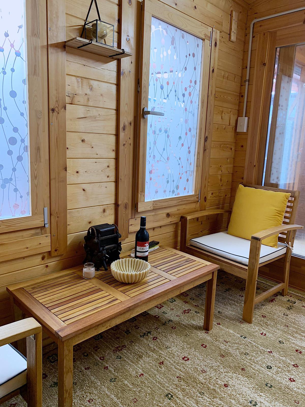 A cosy timber-lined seating nook inside Auckland Airport Cabin.